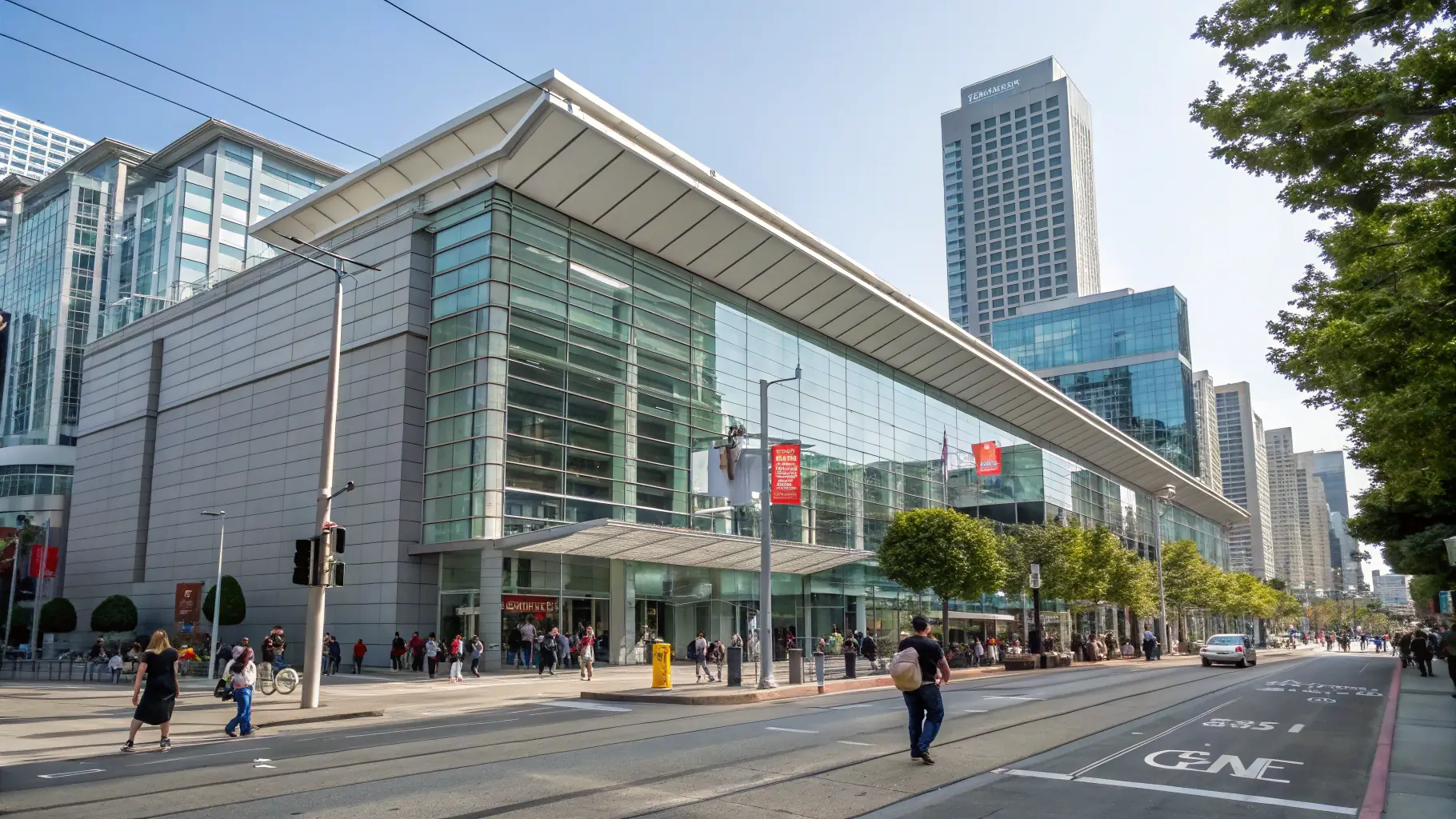 Exterior of the modern Moscone Center in San Francisco, showcasing its architecture and surrounding urban landscape.